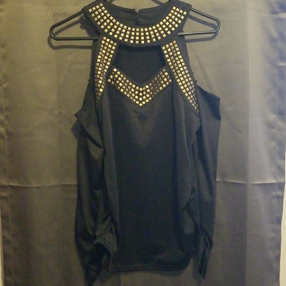 Black shirt with gold stone on it